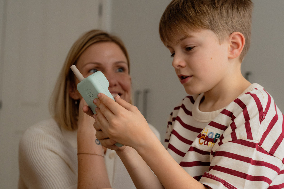 Child using a Waffle screen-free phone to call home safely, no apps or internet